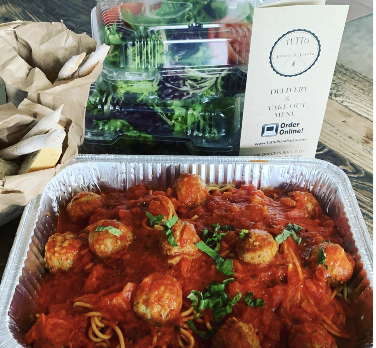 Tuttos Pizza spaghetti and meatballs family meal.png